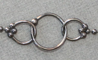 Close up of the balled fine silver circles
